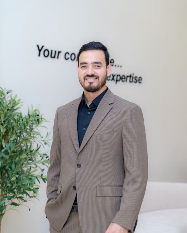 Dr. Nikhil Sharma, orthodontist in Dubai, specialist in invisalign, lingual braces, invisible braces, ceramic braces, and advanced orthodontic treatments.