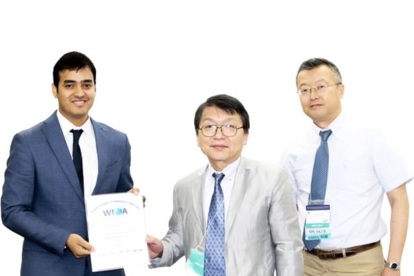 Dr Nikhil Sharma receiving the Young Chel Park Award for Best Research at the World Implant Orthodontic Conference in Japan, 2017.