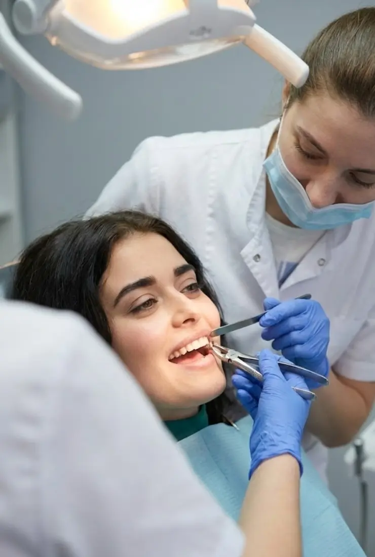 Prosthodontist performing dental restoration treatment on a patient at Invisible Braces Dental Clinic